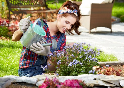 Professional gardener using protective equipment during outdoor maintenance